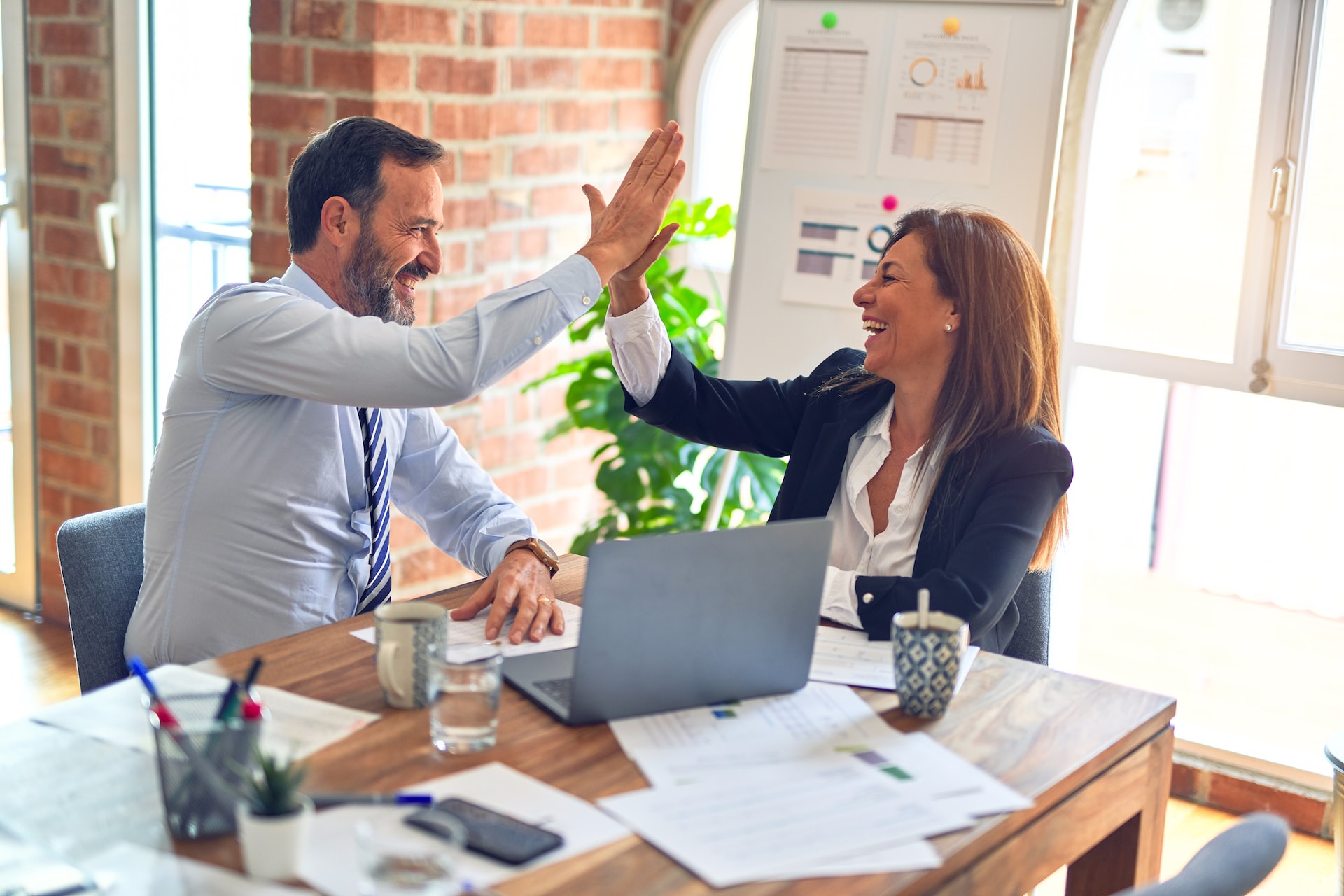 business people doing a high-five